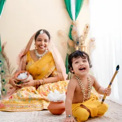 The pure joy of a festive photoshoot! Here, we celebrated Janmashtami with a playful Krishna theme. The laughter from this little one as he holds his flute is what makes these sessions so special.