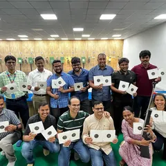 Looking for a unique corporate team building activity? We host groups from various companies for a session of focus, friendly competition, and fun. Here's a team proudly showing their targets after their first shooting experience.