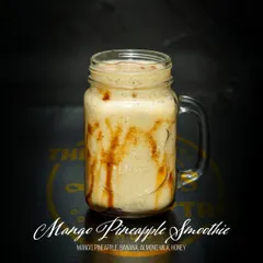 Our Mango Pineapple Smoothie is a tropical delight. We blend mango, pineapple, and banana with almond milk and a touch of honey for a naturally sweet and creamy drink.