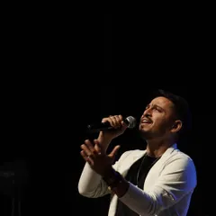 Lost in the melody during a soulful performance. This image captures the emotion and passion I bring to my singing, especially during more intimate and acoustic sets.
