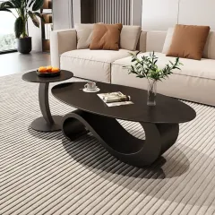This unique center table features a sculptural, wave-like base in a dark matte finish, paired with a matching circular side table. It's a true statement piece for any living room.