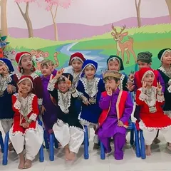 Another view of the happy performers in their Kashmiri costumes, highlighting the comfortable fit that allows them to enjoy their special day.