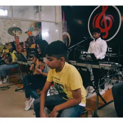 Another angle of a group jam, with students on guitar, keyboard, and the cajon for rhythm. This collaborative learning is central to my teaching philosophy.