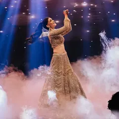 A dreamy and ethereal bridal solo. The use of pink smoke and dramatic backlighting created a magical atmosphere, highlighting the bride's graceful movements.