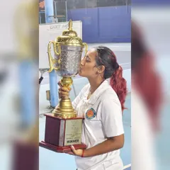 A moment of pure happiness after winning the Open Women's Singles title. Every trophy represents countless hours of practice, a journey I guide my own students through in their competitive tennis training.