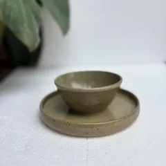 A closer look at the Green Celadon snack plate and bowl. The glaze has a lovely depth and subtle speckling, showing the unique character of our handmade ceramics.