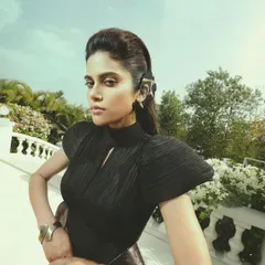 Elegance with an edge. This high-fashion look for Aaditi Pohankar features a dramatic, sculpted hairstyle and sharp, defined makeup that creates a striking and powerful silhouette.