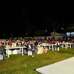 The crowd enjoying the show at the New Year's Gala. Even in a large, open-air setting, I know how to engage the audience and keep them entertained.