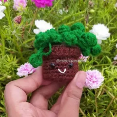 For plant lovers who lack a green thumb, our mini crochet string of pearls pot is the perfect solution. It has a cute smiley face and adds a touch of green to any space without needing any water.
