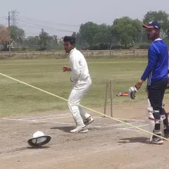 A fielding drill using a helmet on the ground as a target. This improves a fielder's accuracy and ability to hit the stumps directly.