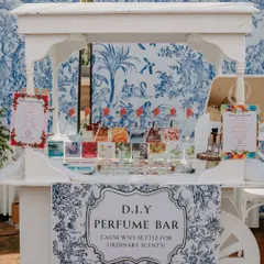 A beautiful D.I.Y. Perfume Bar set up at a carnival-themed event. This interactive stall allowed guests to create their own custom scents, offering a unique and memorable party favor.
