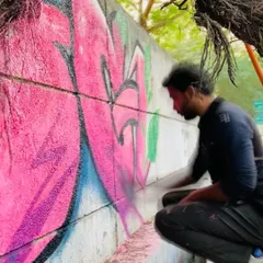 A close-up shot of me working on the pink graffiti piece. The focus and concentration are a key part of the process.