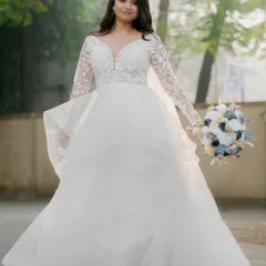 A princess moment for this Catholic bride in her layered white gown. The airbrush makeup provides a flawless, long-lasting base for her special day.