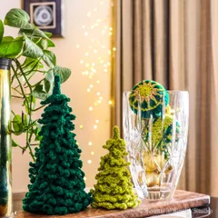 Green is my favourite colour for Christmas. Here are my crochet trees styled with some greenery and another crochet creation peeking out from a glass vase.