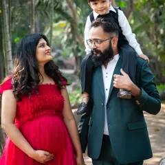 Welcoming a new baby is a family affair. I love capturing the excitement of older siblings, like this sweet moment of a big brother-to-be with his parents, creating a memory for the whole family.