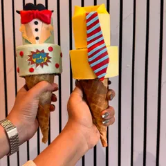 More custom designs for our Father's Day cakesicles. These feature a "Super Dad" emblem and a classic shirt-and-tie look, all handcrafted from edible materials.