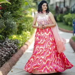 My sweet bride on her Haldi day. We went for a fun and fresh look with curly hair styled in a half-updo and makeup that complemented her colorful lehenga.