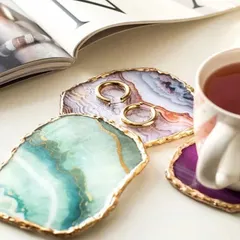 These stunning agate coasters with gold-leafed edges are a unique and high-end wedding favor. Each piece is one-of-a-kind and serves as a beautiful piece of home decor that guests will cherish.