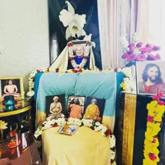A personal home altar set up to honor Swami Kriyananda. This shows how the practice of devotion extends into our daily lives, creating a sacred space wherever we are.
