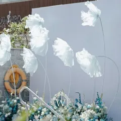 We created a dreamy photo-op for a poolside brunch with these life-sized, cloud-like florals. The whimsical structures against the clear sky provided a perfect, ethereal backdrop for pictures.