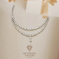 A delicate and sophisticated double-strand diamond necklace, perfect for adding a touch of sparkle to any look. A timeless gift of love.