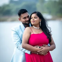 A romantic outdoor shot by the water. The makeup is fresh and radiant, designed to look beautiful in natural daylight, with a pop of color from the bright pink dress.