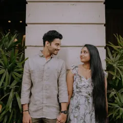 A sweet moment of connection. This candid shot captures the loving gaze between the couple during their pre-wedding shoot in the streets of Mumbai.