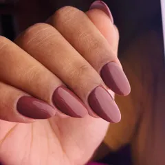 A rich and sophisticated single-color manicure. This deep, chocolatey mauve is a perfect neutral shade that is both modern and timeless.