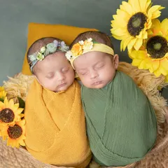 Two little sunflowers sleeping side-by-side. I love coordinating colors and props to create a harmonious and beautiful portrait for twins.