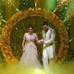 The couple's entrance should be nothing short of spectacular. I designed this shimmering golden halo with integrated pyrotechnics and a soft fog effect to make them feel like they are walking on clouds as they enter their Sangeet.
