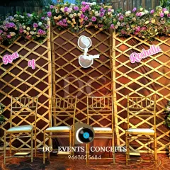 A beautiful fusion of rustic and modern for this Roce ceremony. The wooden lattice backdrop is paired with a lush floral arrangement and a sign with the couple's names, creating a personalized and stylish setting.