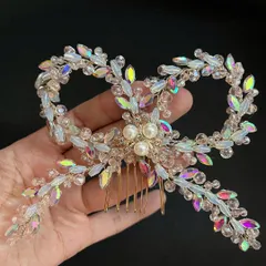 For my brides who love a bit of drama and sparkle, this crystal bow comb is a total showstopper. The way it catches the light is just magical, perfect for your reception or cocktail look.