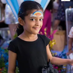 A simple yet beautiful rainbow painted on a child's forehead. It's a quick, sweet design that always gets a happy smile.