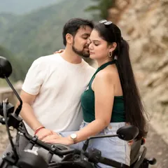 An intimate moment on a motorcycle against the backdrop of the Uttarakhand hills. This shot combines romance with a sense of adventure, perfect for a destination pre-wedding shoot.