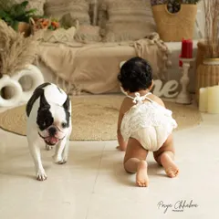 The sweetest duo! This one-year-old and her playful pup are the perfect pair, and their bond was a joy to capture during this fun-filled studio session.