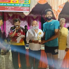 One of our senior players receiving an award at a tournament. Recognizing individual performance is part of celebrating the team's overall success.