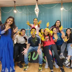 We are the Aura Family, and this is how we celebrate. This moment from our studio's Holi party captures the joy and community spirit that you'll find in our classes every single day.