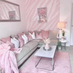 For a fun and modern living room, we created a bold zebra-stripe pattern in two shades of pink. This shows how patterned walls can be used to express personality and create a truly unique and energetic space.