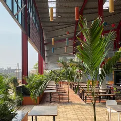 The "Foods Arena" in Hubballi is a large, open food court I designed using a Pre-engineered Building (PEB) system. The red superstructure and interior landscaping create a vibrant and welcoming public space.