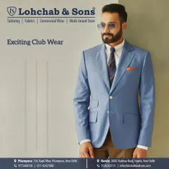 Add a touch of color to your formal wardrobe with our bespoke blazers. This light blue jacket, paired with brown trousers, offers a stylish and refreshing look for club events or smart-casual gatherings.