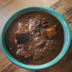 A close look at my Anishi with Pork, a signature dish from the Ao Naga tribe. It's a rich, smoky curry made with fermented taro leaves and tender pork, a flavour you won't find anywhere else.