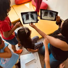 When a Playmaker returned after a lung infection, the children's questions turned into a learning moment. They became pulmonologists for the day, examining CT scans and learning how lungs work.