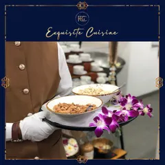 A server holding a tray with bowls of roasted almonds and cashews. This simple gesture of hospitality ensures guests have something to nibble on throughout the event.