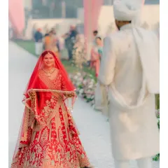 The first look. The bride, holding the kalire, walks towards her groom. It's a moment thick with anticipation and emotion, the beginning of their forever.