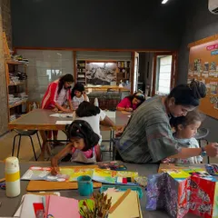 A wide view of our summer camp in full swing. You can see the focus and collaboration as students work on their individual artist books, with instructors providing guidance.