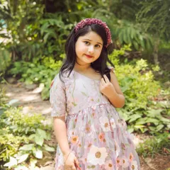 A close-up of this cutie in her floral crown. Outdoor kids' photography in natural light brings out a soft and dreamy quality in the images.