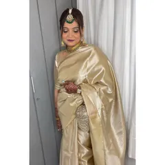 It's an honor to get the mother of the bride ready. For her, I created a timeless and elegant look with a classic hair bun and makeup that enhanced her natural grace, perfectly complementing her beautiful golden saree.