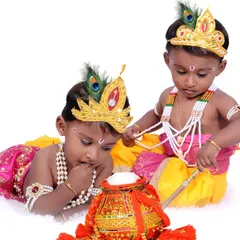 An adorable shot of two young brothers dressed as Bala Krishna. I provide all the costumes and props, including the pot of butter, for a complete and authentic look.