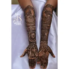 This design tells a story with different figures on each arm, including a bride, a groom, and auspicious symbols like the kalash and peacock. It's a narrative piece for a very special occasion.