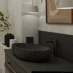 A detail shot of the raw, hand-carved stone basin, which adds a rustic and organic element to the otherwise sleek and modern bathroom design.
